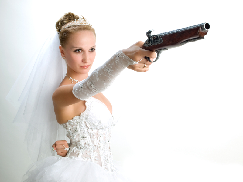 bride holding the old gun